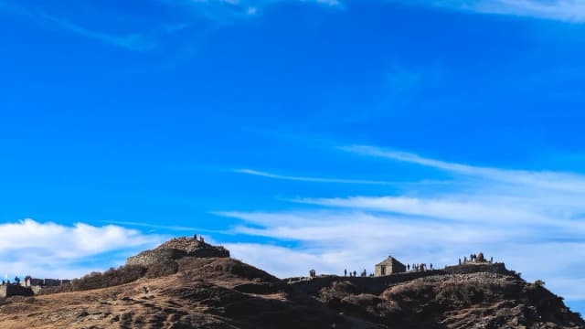 The view from a hilltop under an open sky