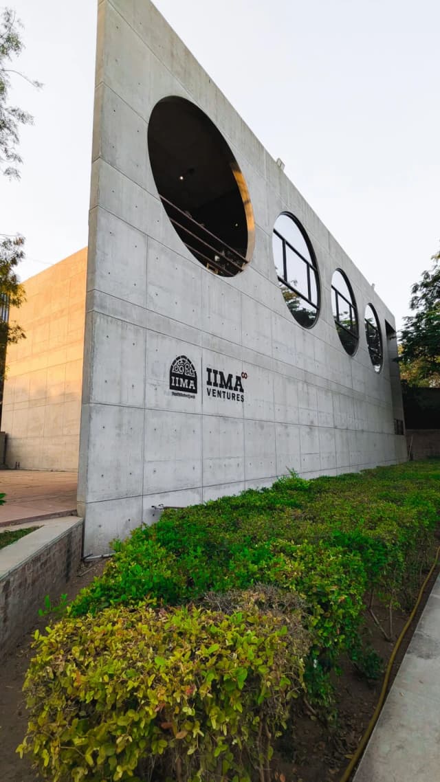 The brick and concrete architecture of the IIM Ahmedabad campus