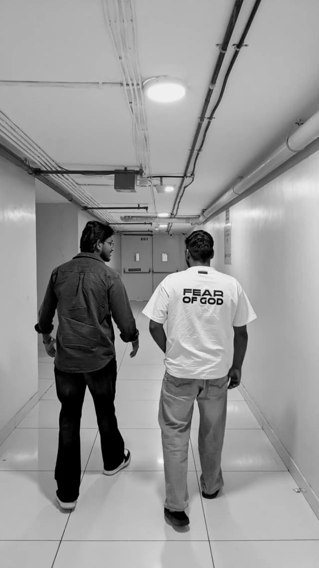 Walking an office corridor with a teammate
